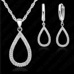 The Rhinestone Statement Pendant Necklace and drop earrings in 925 silver